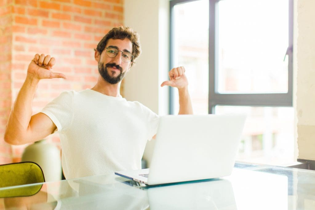 man looking smug about his website he's built himself